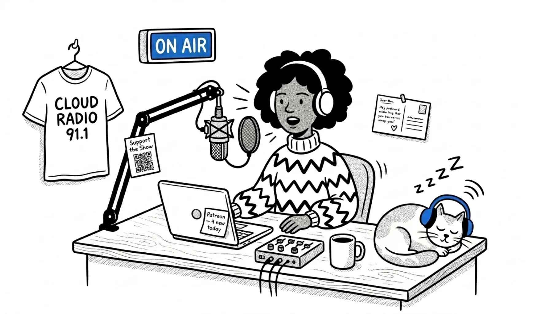 Internet radio host on-air at her desk with a microphone, laptop showing a Patreon notification, a Support the Show QR code on the mic boom, a station merch t-shirt on the wall, a fan postcard, and a sleeping cat in blue headphones.